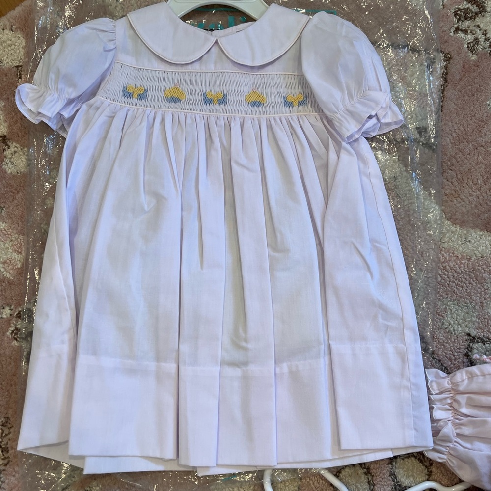 Like new smocked cupcake and gift dress. Looks brand new!